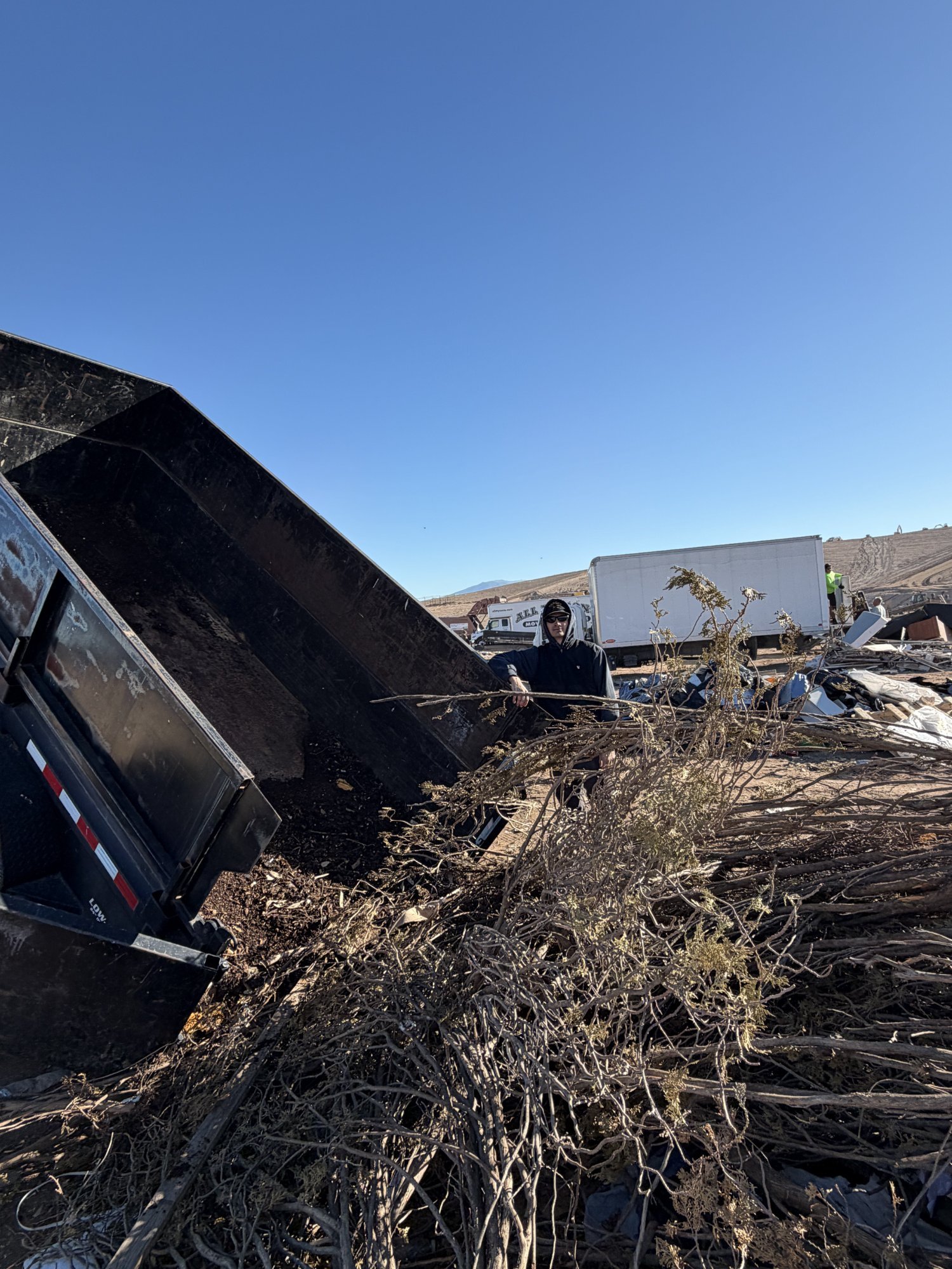 Junk removal service in Tucson AZ - Haul Heroes crew hauling furniture and debris